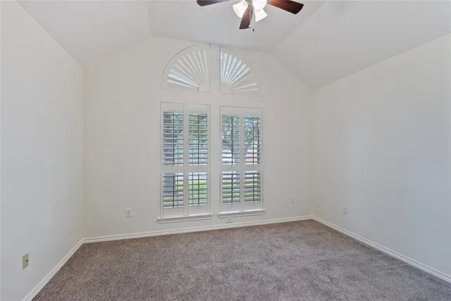 an empty room with a empty space and a window