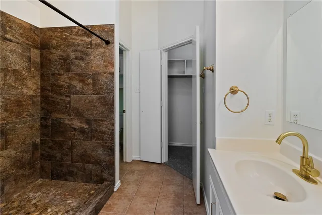 a bathroom with a sink and a shower