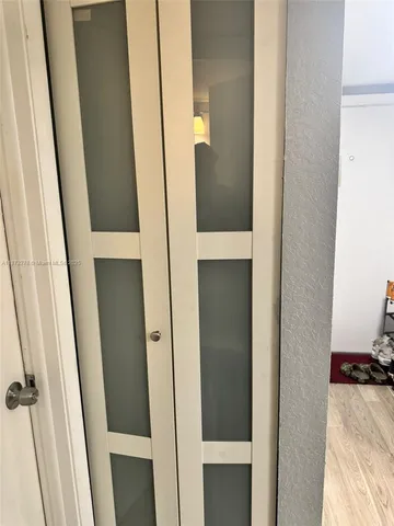 a view of a bathroom from a corridor