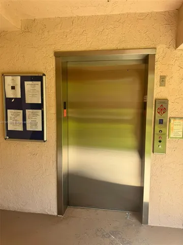 a view of balcony with wooden floor and fence