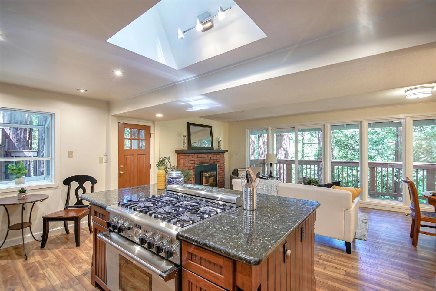 10165 Alba Road Ben Lomond, CA 95005 - Photo 1 of 44 a living room with furniture a table and a fireplace