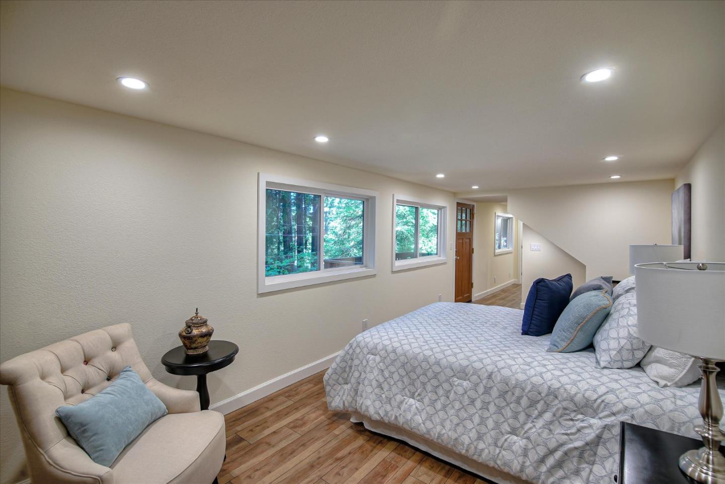 10165 Alba Road Ben Lomond, CA 95005 - Photo 19 of 44 a bedroom with a bed and wooden floor