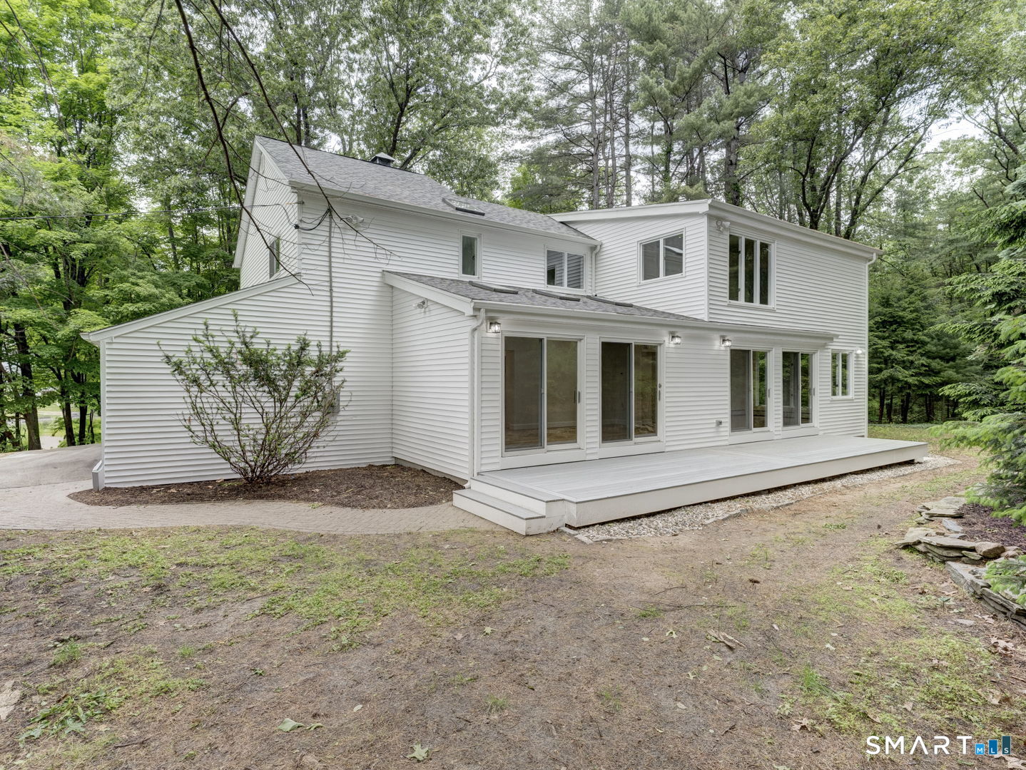 243 Brickyard Road Farmington, CT 06032 - Photo 4 of 34 4 Sliders from Dining Room and Family Room to a large Trex Deck