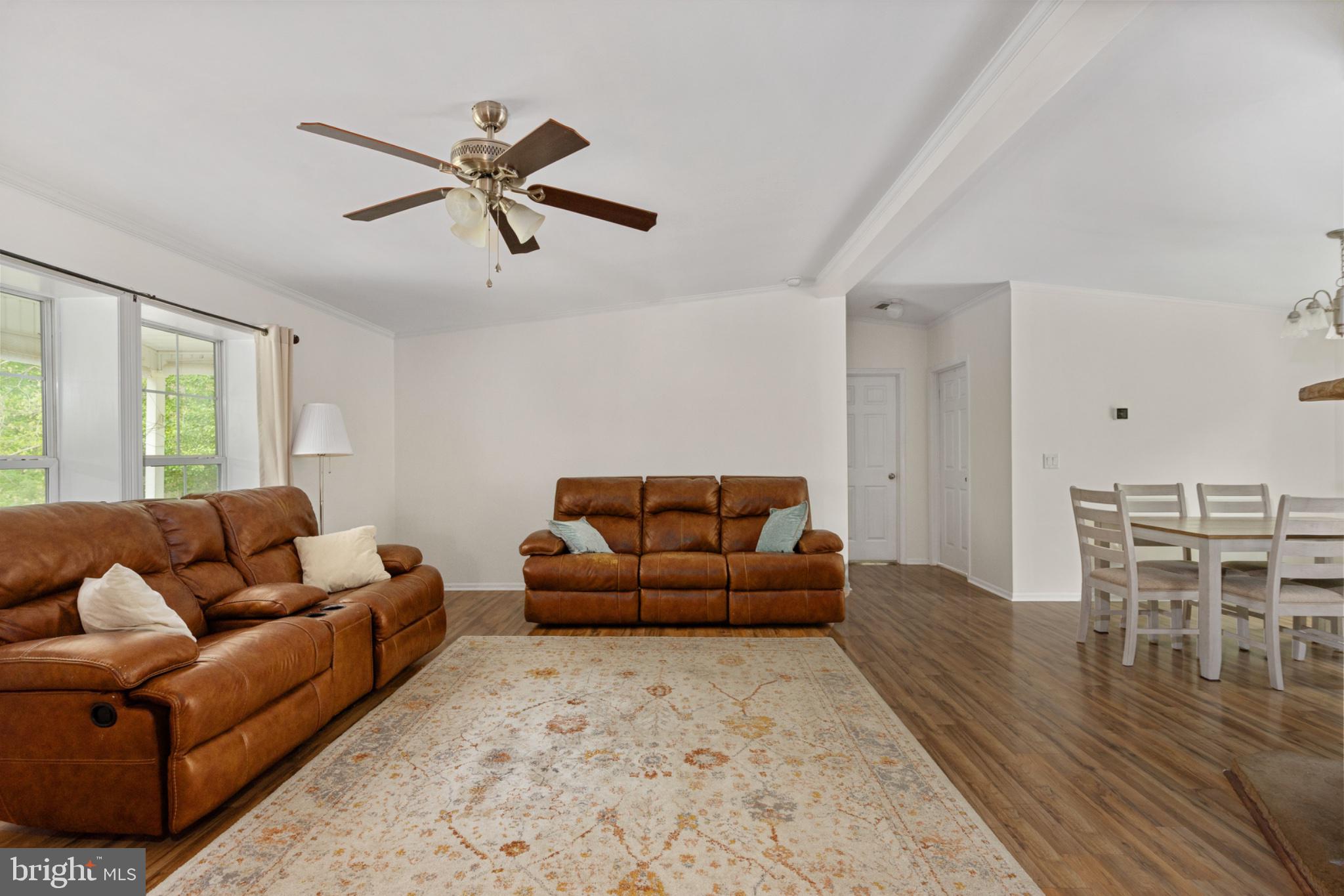 2319 Sizer Road Beaverdam, VA 23015 - Photo 21 of 61 a living room with furniture and a wooden floor