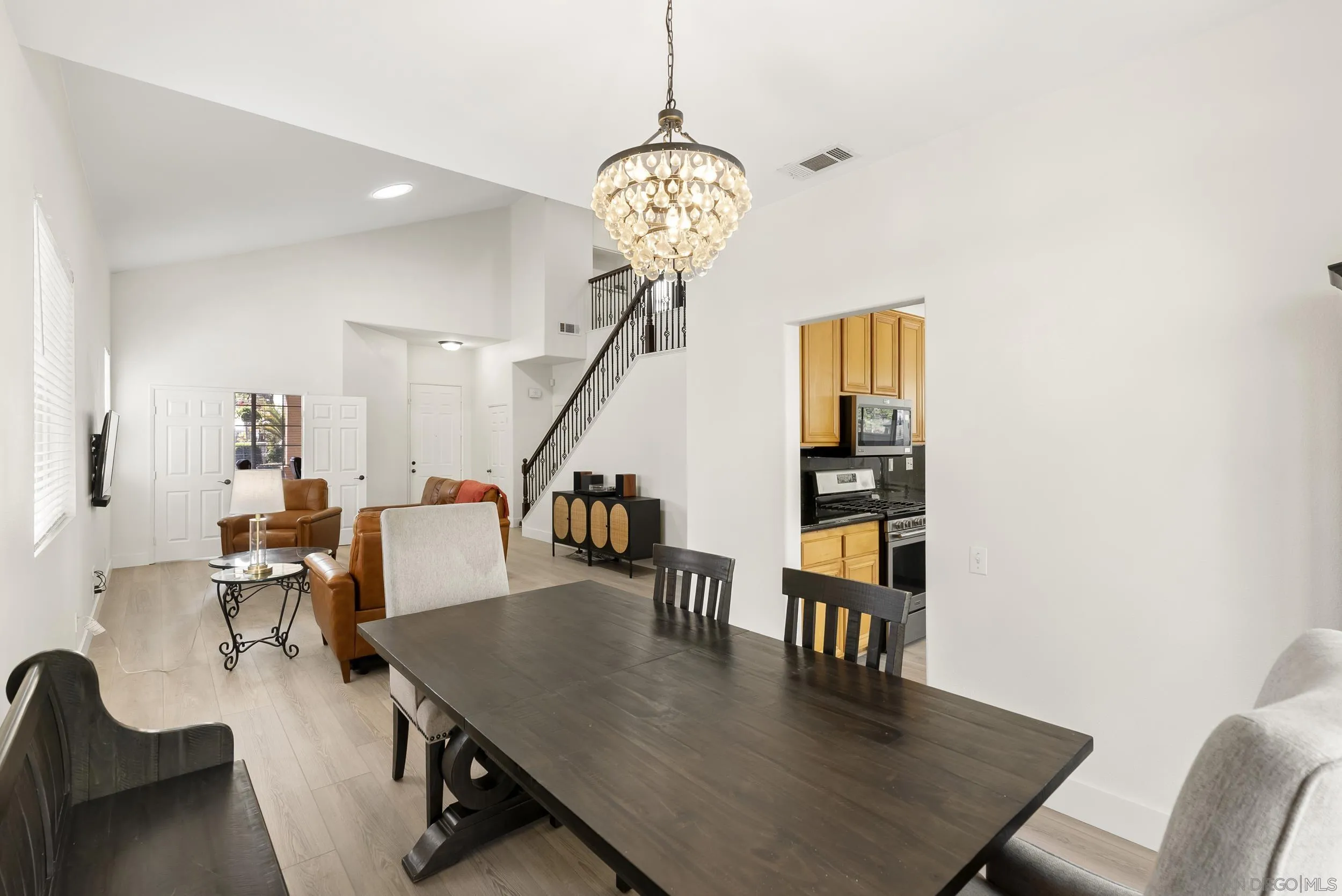 1405 Carneros Valley Street Chula Vista, CA 91913 - Photo 13 of 45 a view of a dining room with furniture and wooden floor