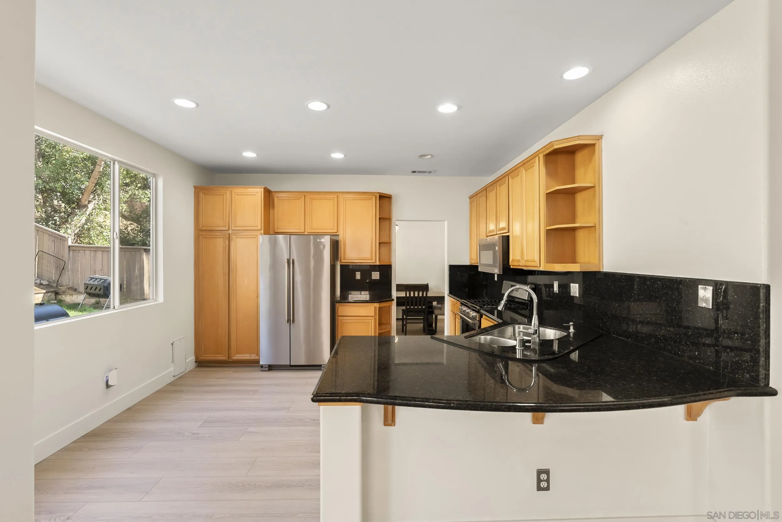 1405 Carneros Valley Street Chula Vista, CA 91913 - Photo 15 of 45 a kitchen with stainless steel appliances granite countertop a sink a stove and a refrigerator