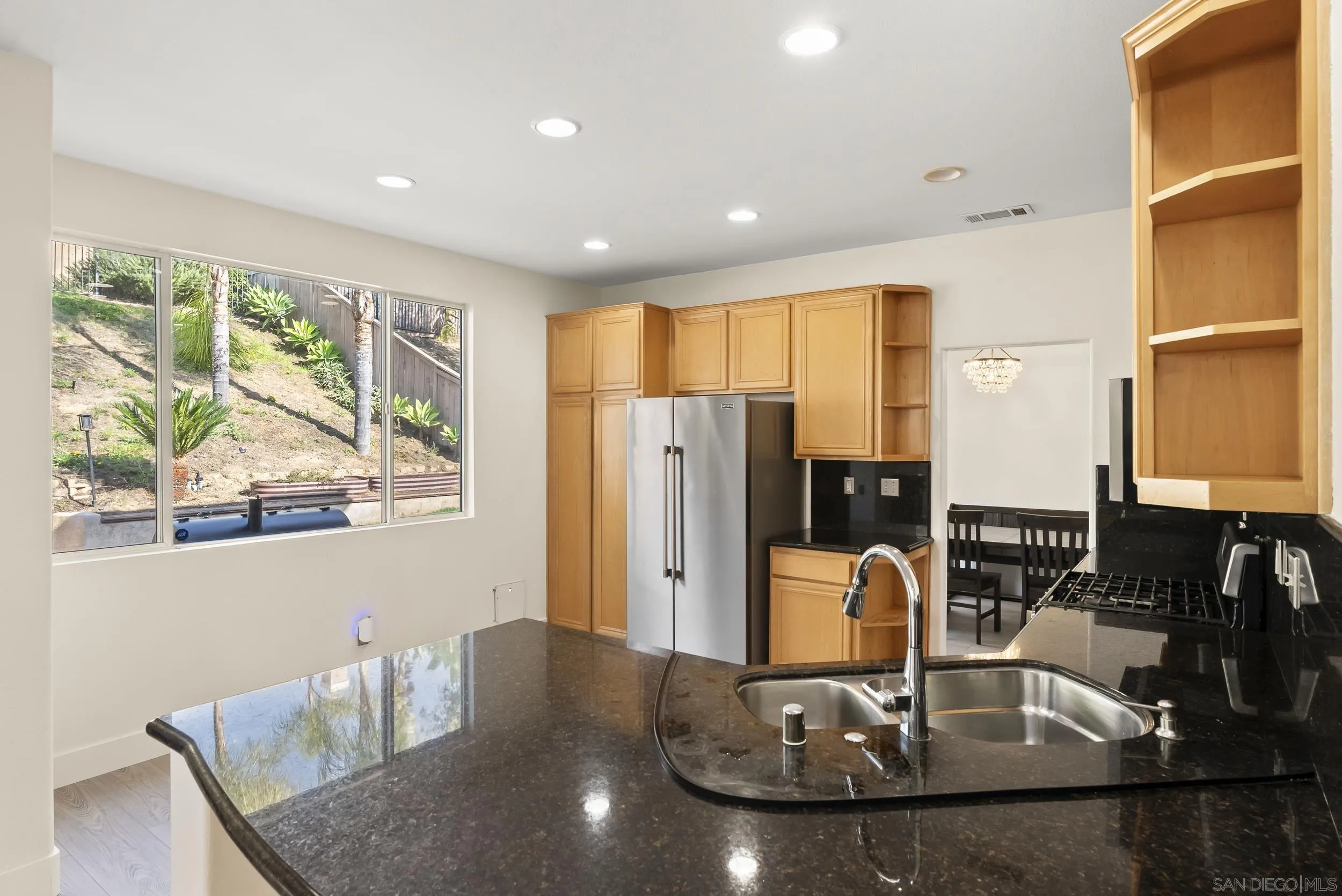 1405 Carneros Valley Street Chula Vista, CA 91913 - Photo 17 of 45 a kitchen with a table and chairs