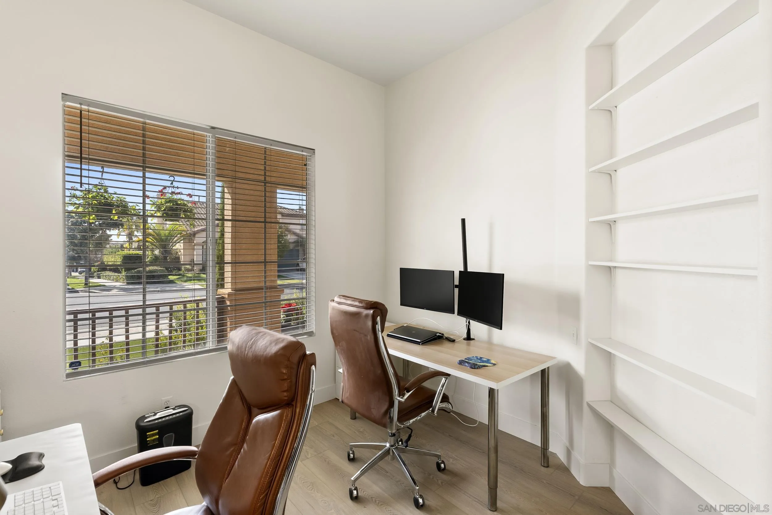 1405 Carneros Valley Street Chula Vista, CA 91913 - Photo 22 of 45 a view of a workspace with furniture and a window