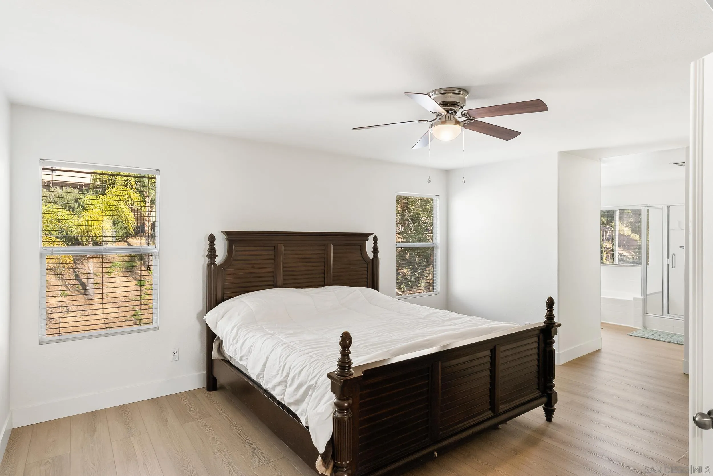 1405 Carneros Valley Street Chula Vista, CA 91913 - Photo 24 of 45 a bedroom with a bed and a chandelier