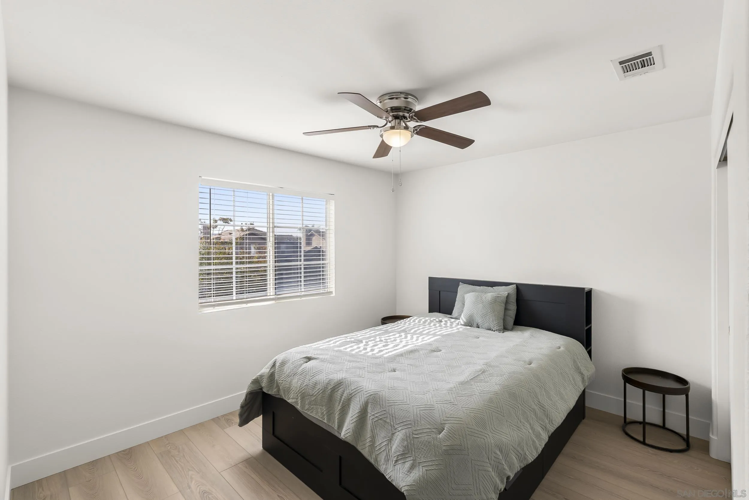 1405 Carneros Valley Street Chula Vista, CA 91913 - Photo 30 of 45 a bedroom with a large bed and a window