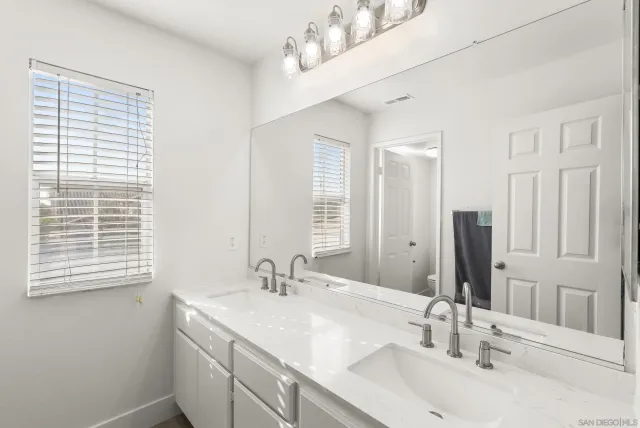 a bathroom with a toilet and a sink