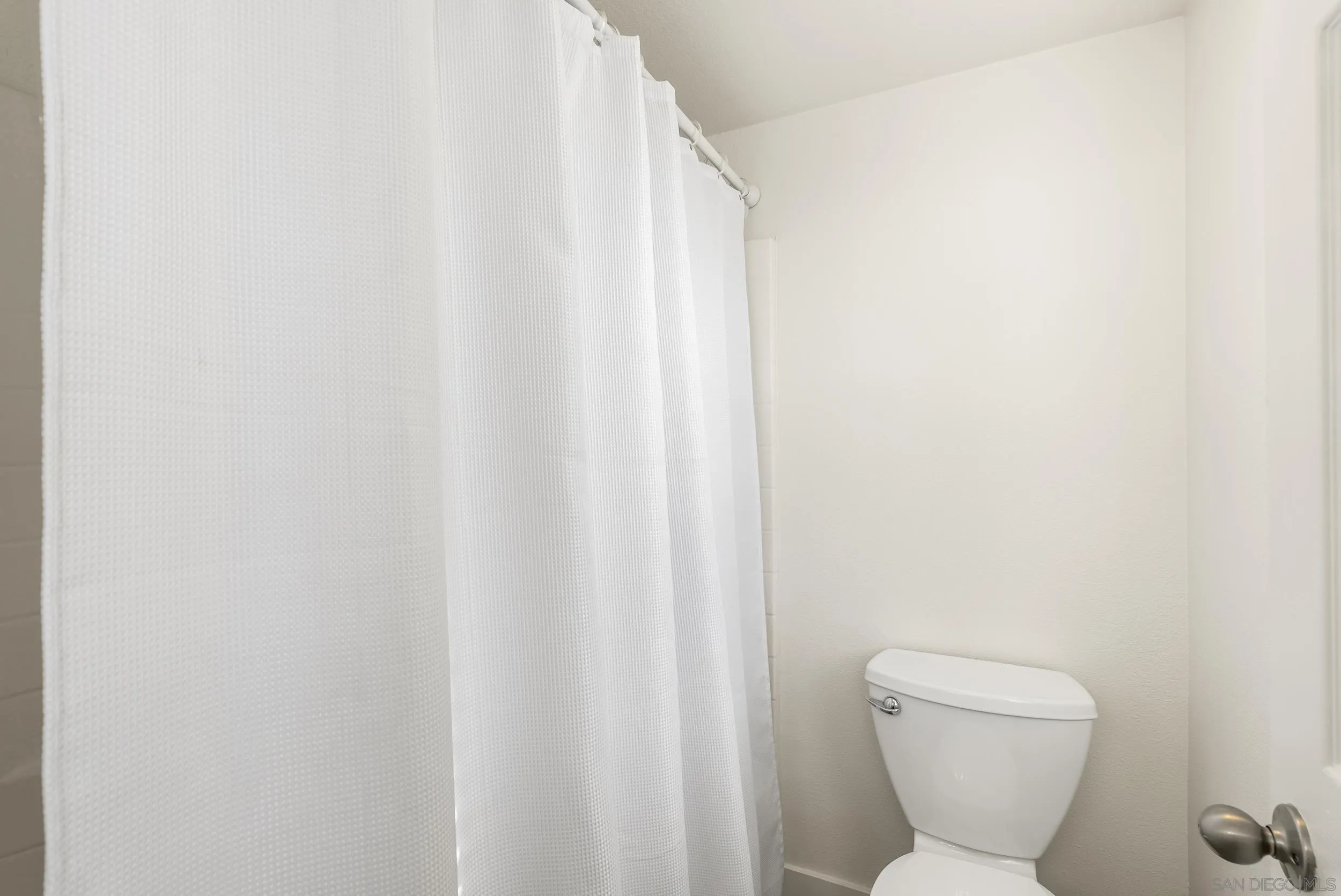 1405 Carneros Valley Street Chula Vista, CA 91913 - Photo 33 of 45 a bathroom with a toilet and a sink