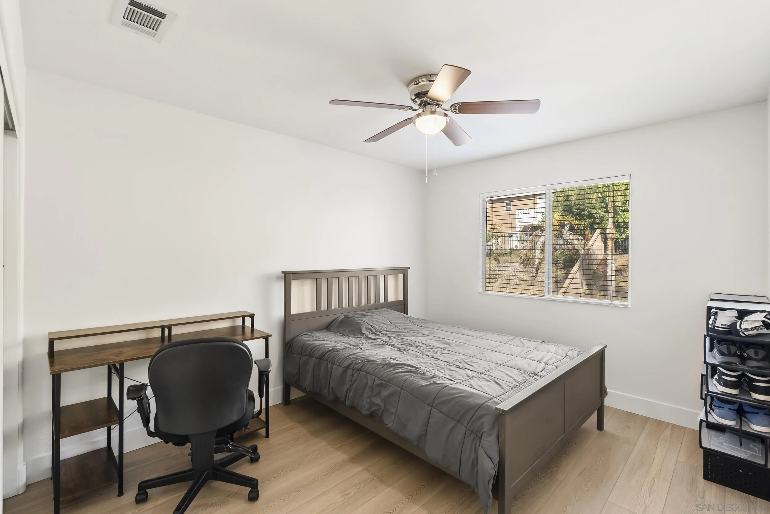 1405 Carneros Valley Street Chula Vista, CA 91913 - Photo 35 of 45 a bedroom with a bed window and a chair