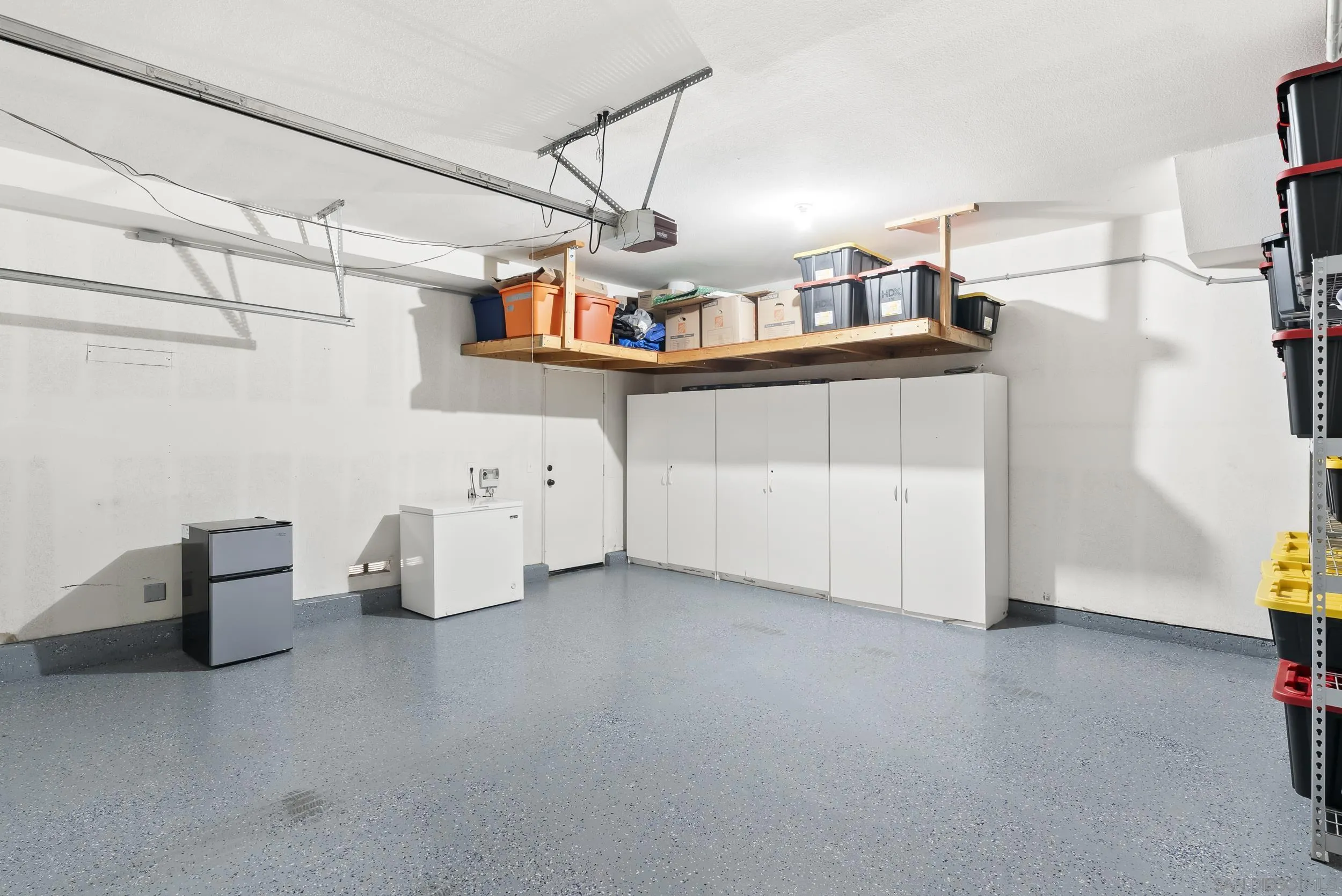 1405 Carneros Valley Street Chula Vista, CA 91913 - Photo 37 of 45 a view of a room with racks on the wall