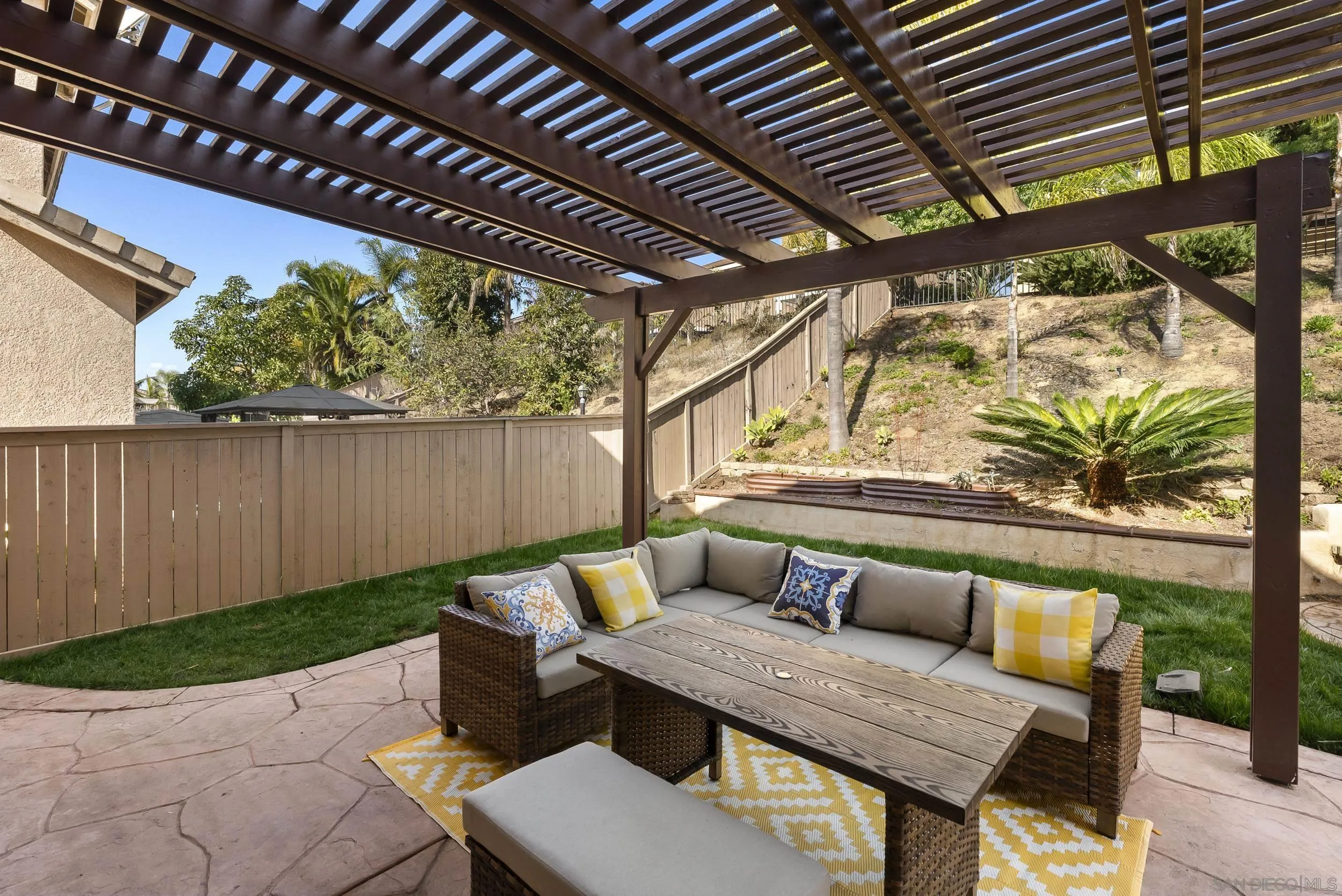 1405 Carneros Valley Street Chula Vista, CA 91913 - Photo 41 of 45 a roof deck with a table and chairs with wooden floor
