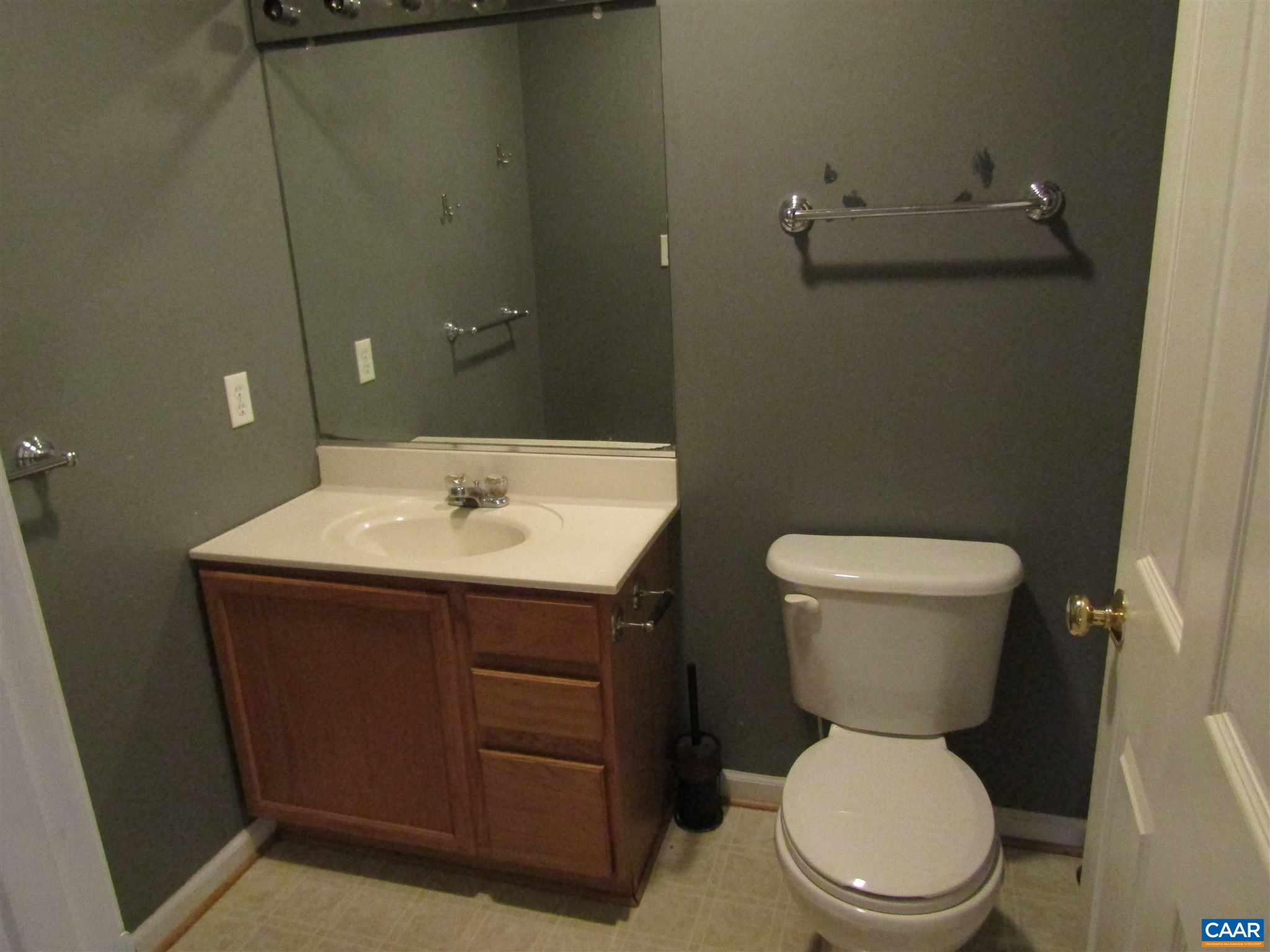 57 Riverside Drive Palmyra, VA 22963 - Photo 5 of 10 a bathroom with a sink toilet and a mirror