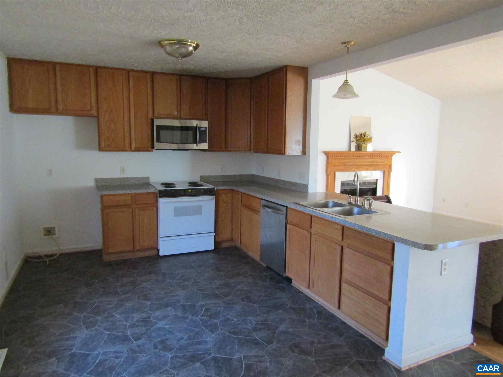57 Riverside Drive Palmyra, VA 22963 - Photo 6 of 10 a kitchen with cabinets a sink and a stove