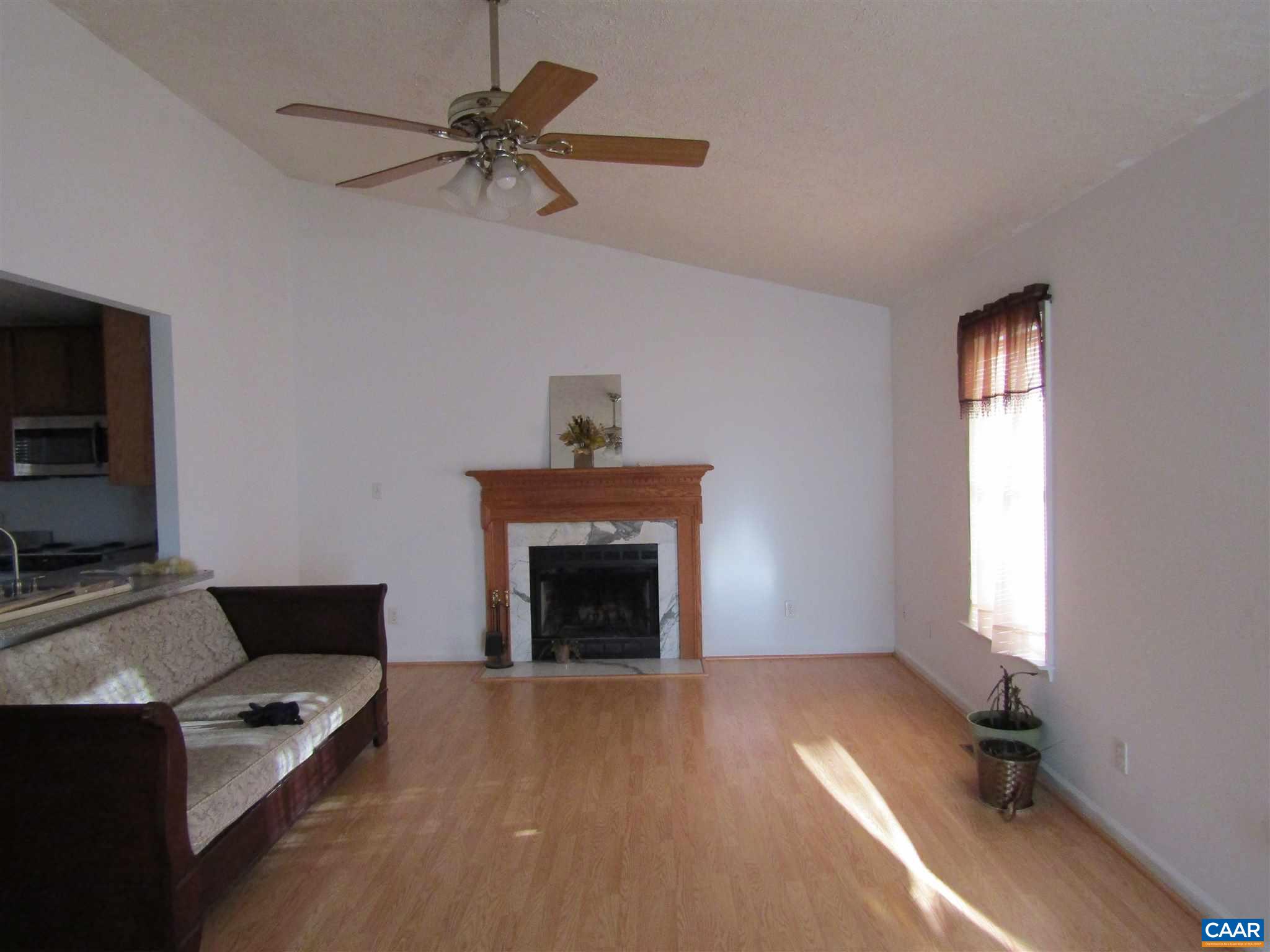 57 Riverside Drive Palmyra, VA 22963 - Photo 7 of 10 a living room with furniture and a fireplace