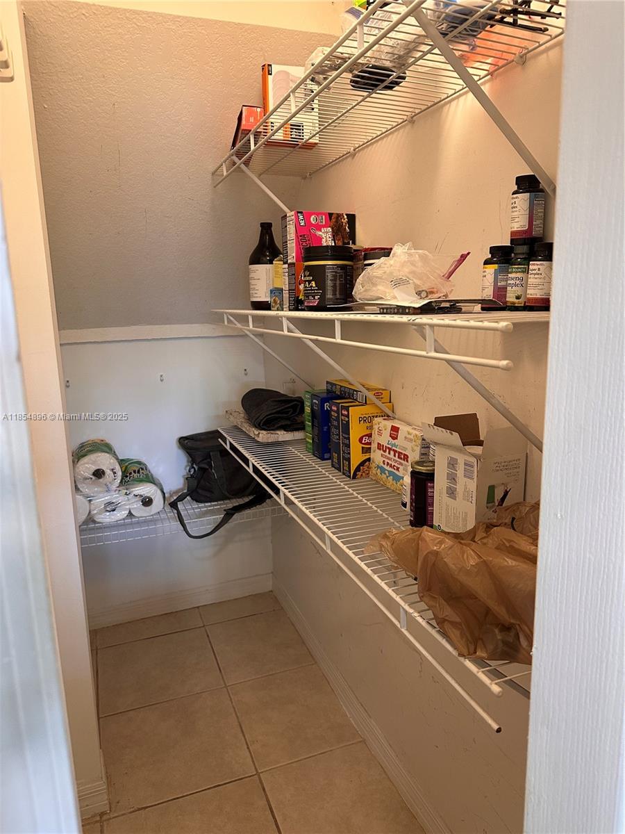 8908 Southwest 109th Avenue Miami, FL 33176 - Photo 11 of 28 a kitchen with a refrigerator and a sink
