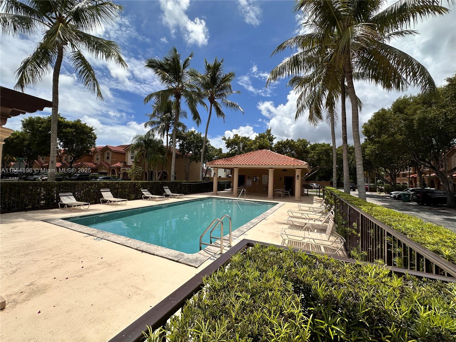 8908 Southwest 109th Avenue Miami, FL 33176 - Photo 4 of 28 a view of a backyard with swimming pool