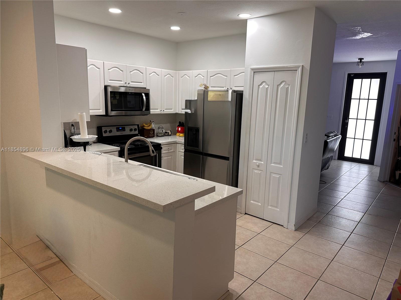 8908 Southwest 109th Avenue Miami, FL 33176 - Photo 6 of 28 a kitchen with stainless steel appliances a refrigerator sink and microwave