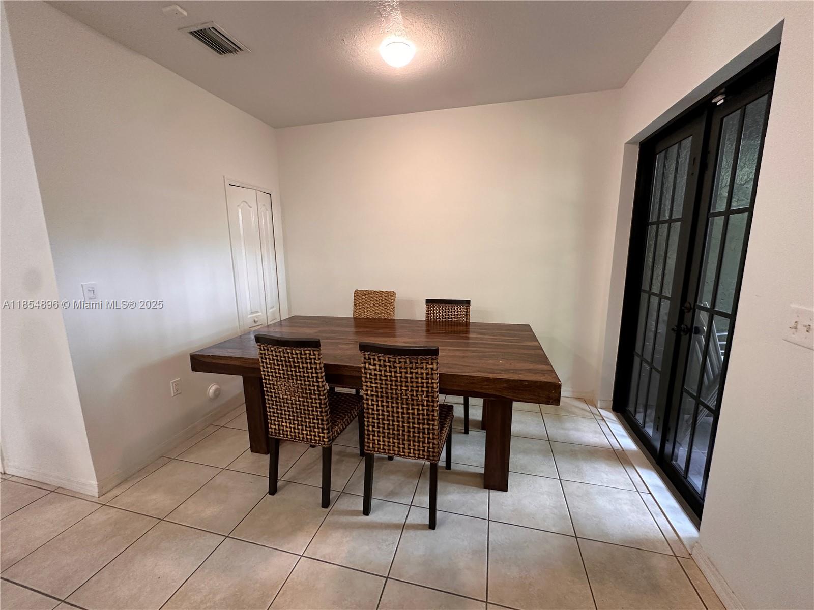 8908 Southwest 109th Avenue Miami, FL 33176 - Photo 10 of 28 a view of a dining room with furniture
