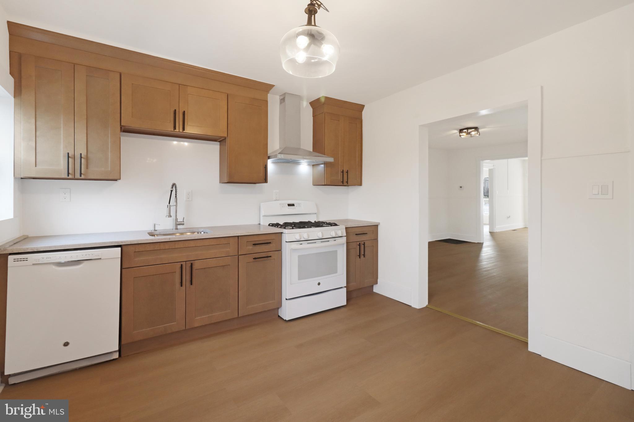 24369 West Main Street, Unit A Columbus, NJ 08022 - Photo 19 of 69 a kitchen with white cabinets and white appliances