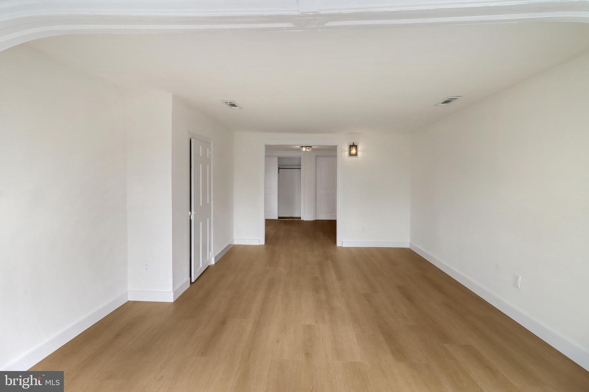 24369 West Main Street, Unit A Columbus, NJ 08022 - Photo 34 of 69 a view of an empty room with wooden floor