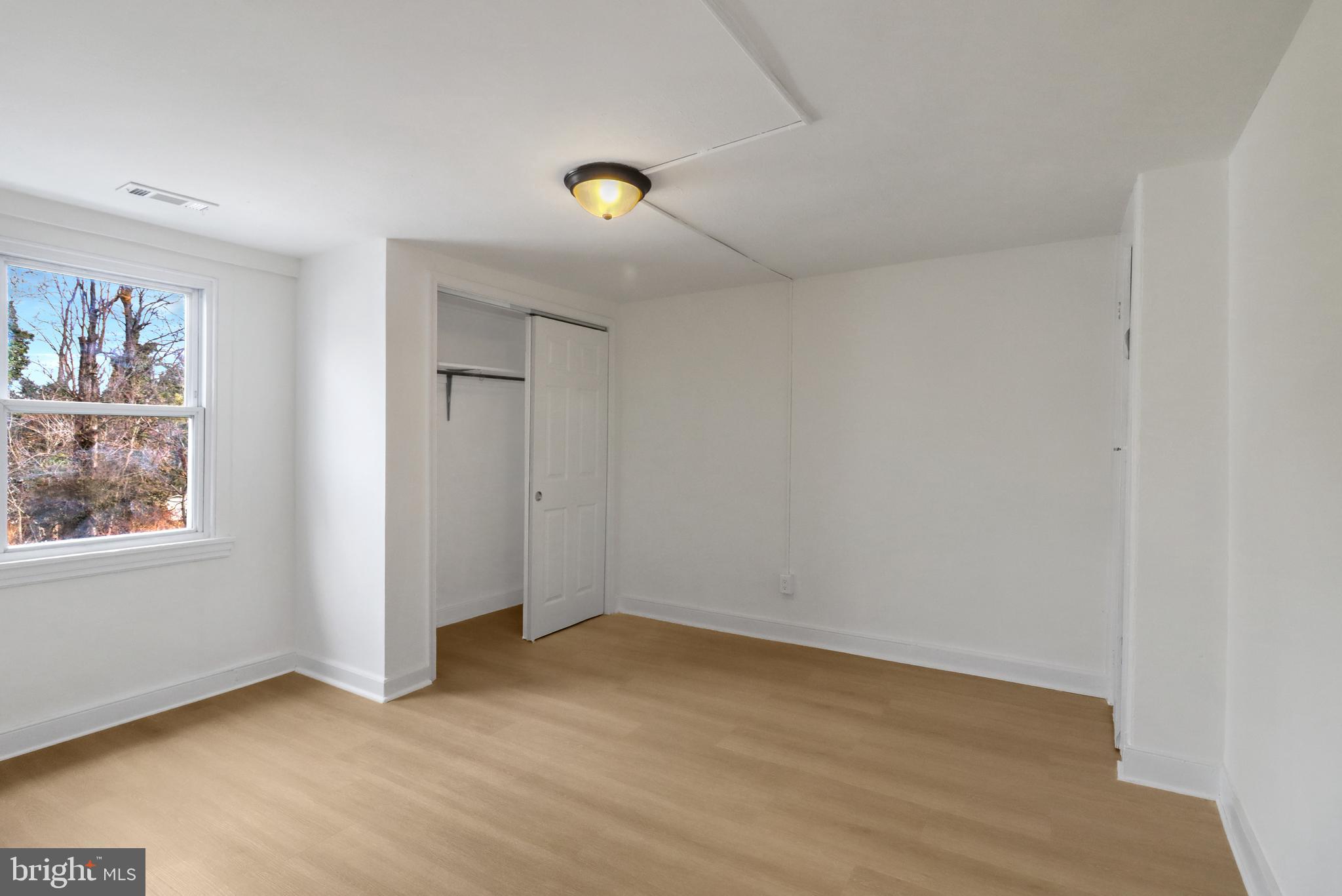 24369 West Main Street, Unit A Columbus, NJ 08022 - Photo 47 of 69 an empty room with windows