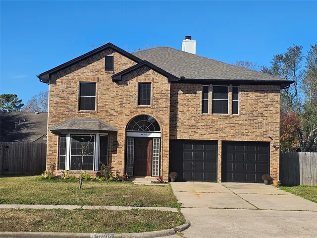 a front view of a house with yard