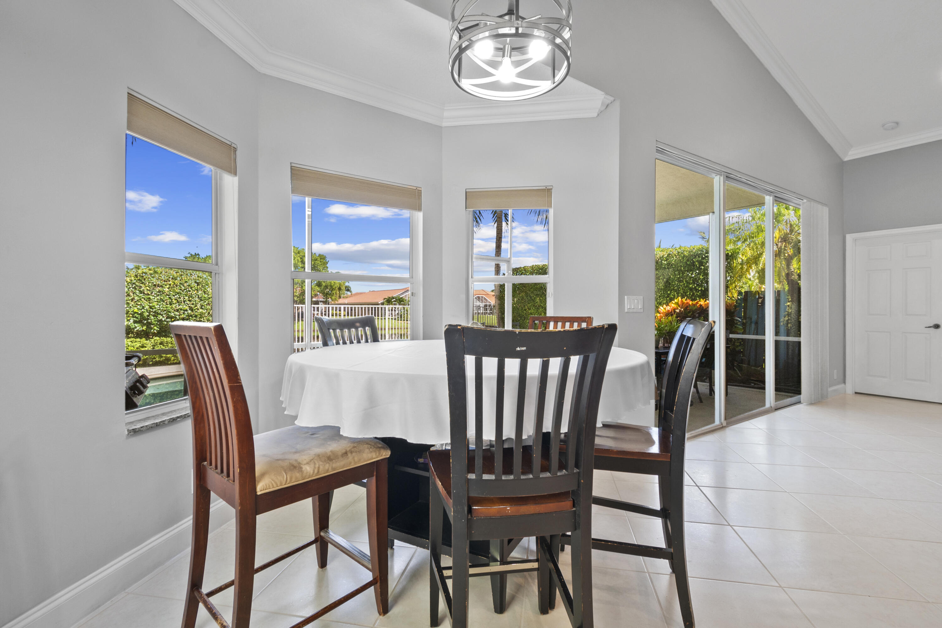 3526 Old Lighthouse Circle Wellington, FL 33414 - Photo 5 of 35 Dining overlooking pool and lake