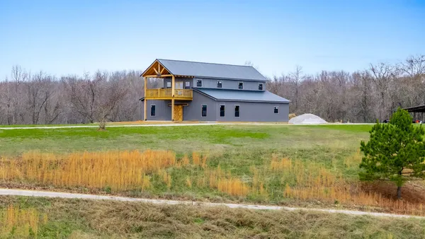 a view of a yard from a balcony