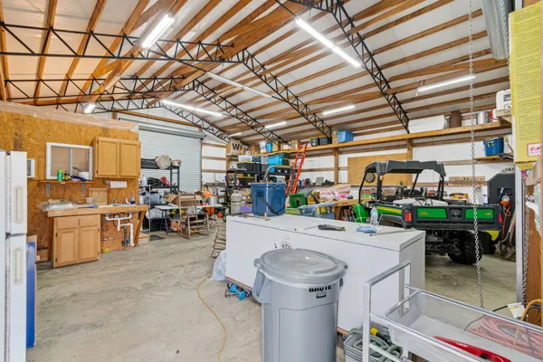 a view of a dry yard with green space