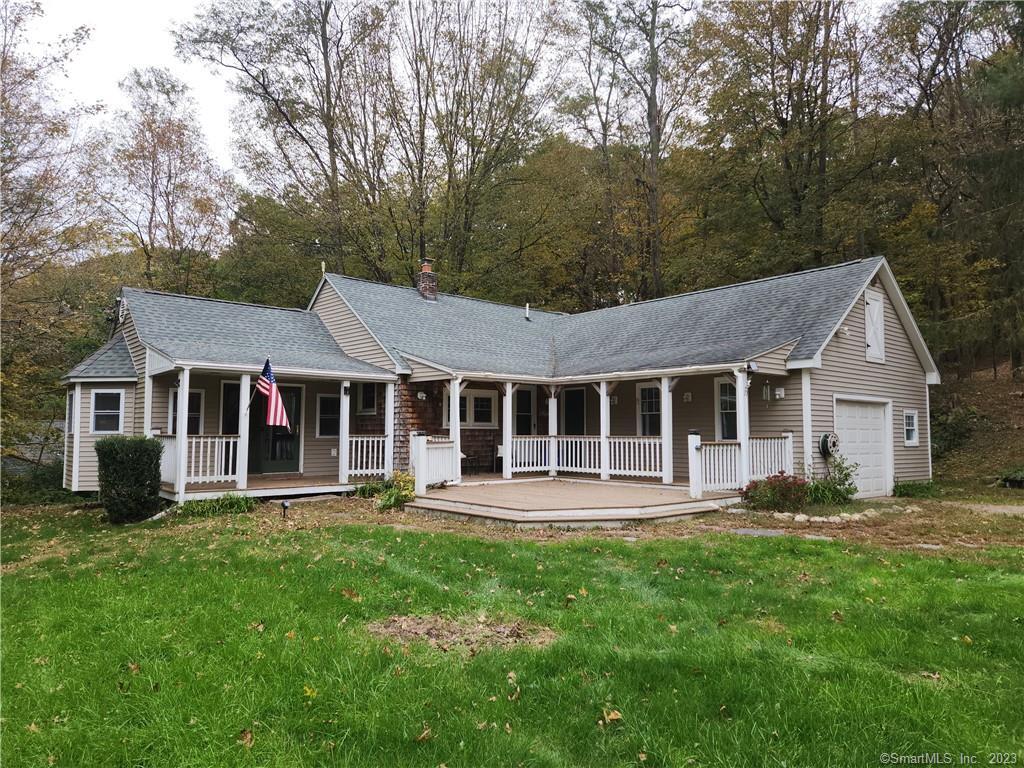 20 Rogers Road Norwich, CT 06360 - Photo 1 of 1 a front view of a house with a yard and trees