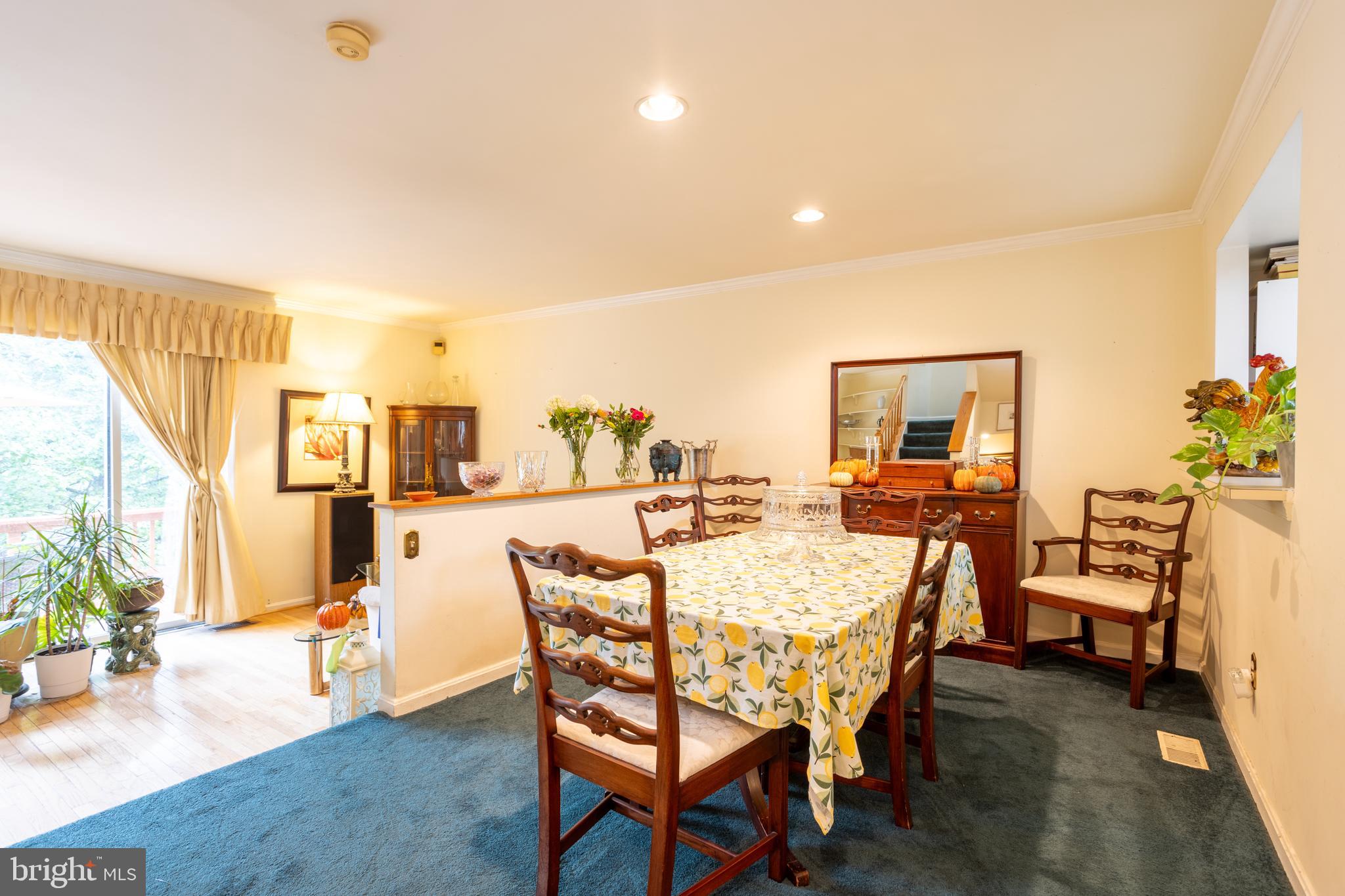 5065 Columbia Road, Unit 18 11 Columbia, MD 21044 - Photo 12 of 51 a dining room with furniture and wooden floor