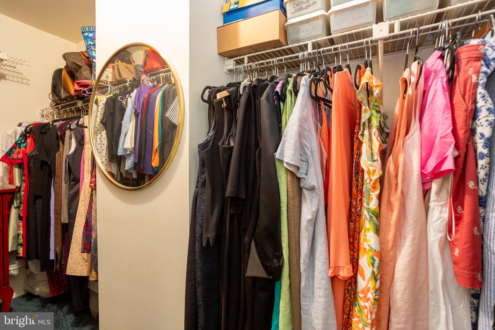 5065 Columbia Road, Unit 18 11 Columbia, MD 21044 - Photo 21 of 51 a view of walk in closet with clothes and shoes