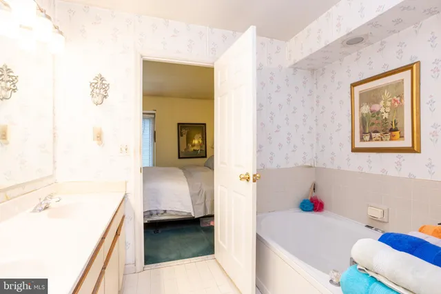 a bathroom with a tub and sink