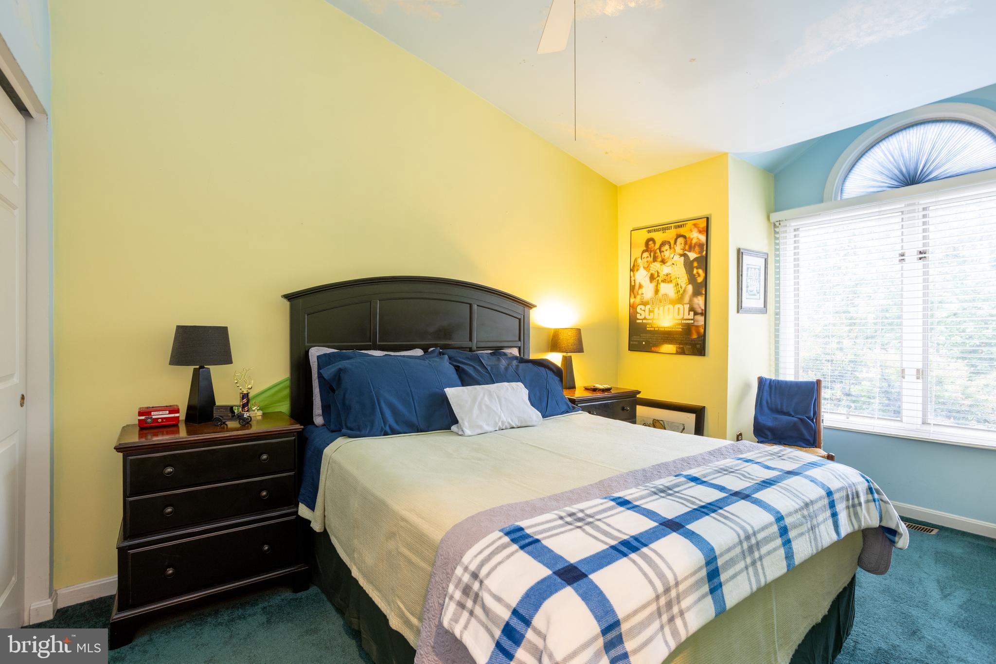 5065 Columbia Road, Unit 18 11 Columbia, MD 21044 - Photo 28 of 51 a bedroom with a bed and wooden floor