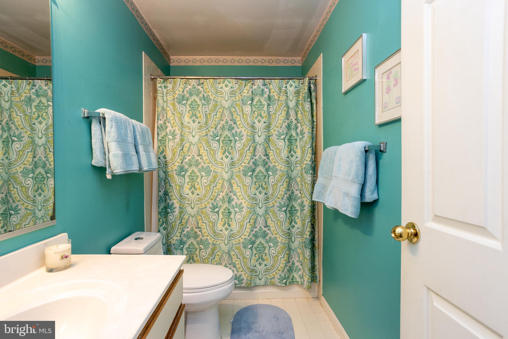 5065 Columbia Road, Unit 18 11 Columbia, MD 21044 - Photo 32 of 51 a bathroom with a sink toilet and shower