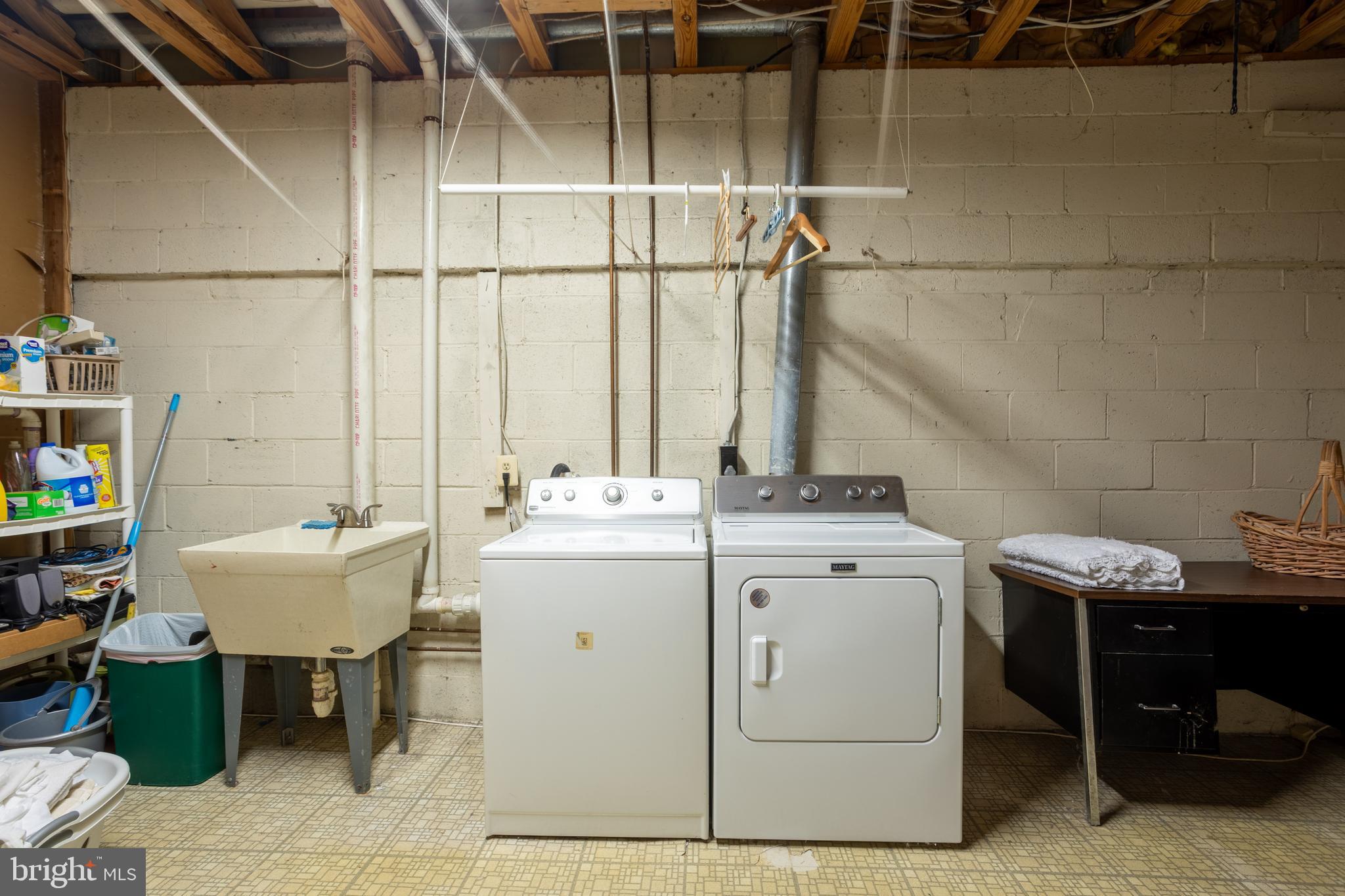 5065 Columbia Road, Unit 18 11 Columbia, MD 21044 - Photo 41 of 51 a utility room with a sink dryer and washer