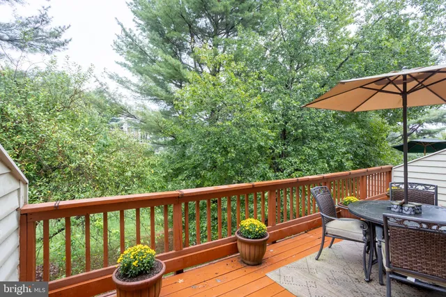 a view of a patio with a table and chairs