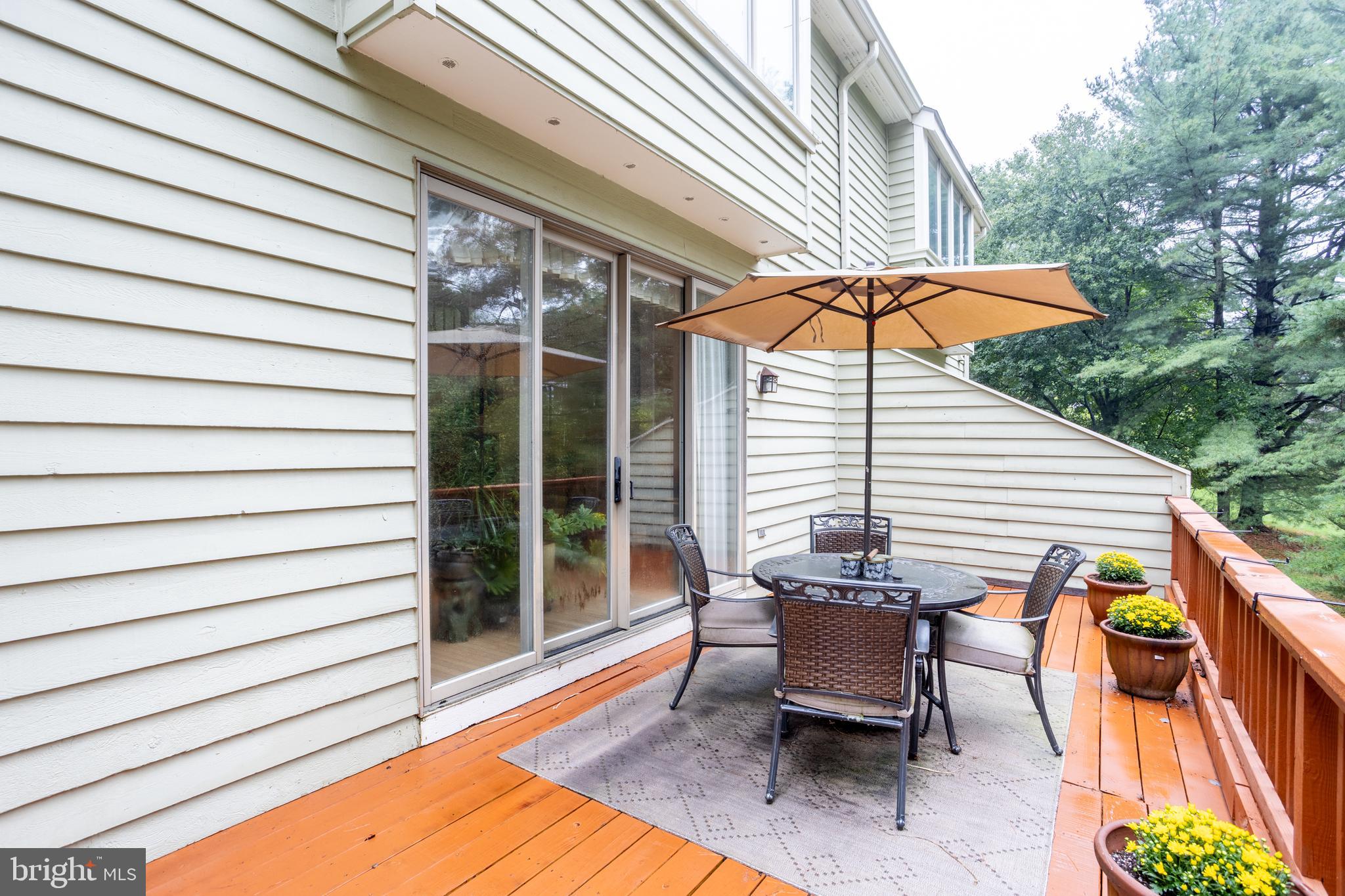 5065 Columbia Road, Unit 18 11 Columbia, MD 21044 - Photo 44 of 51 a view of a patio with a table and chairs