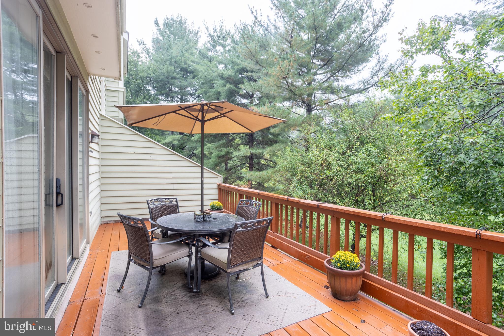 5065 Columbia Road, Unit 18 11 Columbia, MD 21044 - Photo 46 of 51 a view of a chair and table on the balcony