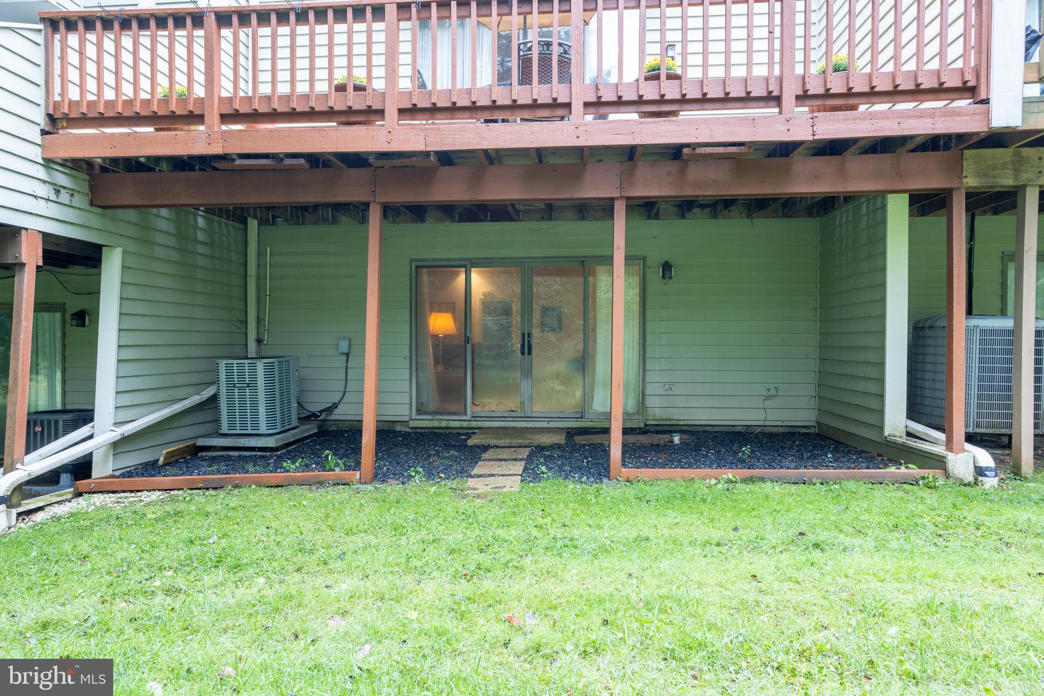 5065 Columbia Road, Unit 18 11 Columbia, MD 21044 - Photo 48 of 51 a view of a backyard with a small cabin and wooden fence