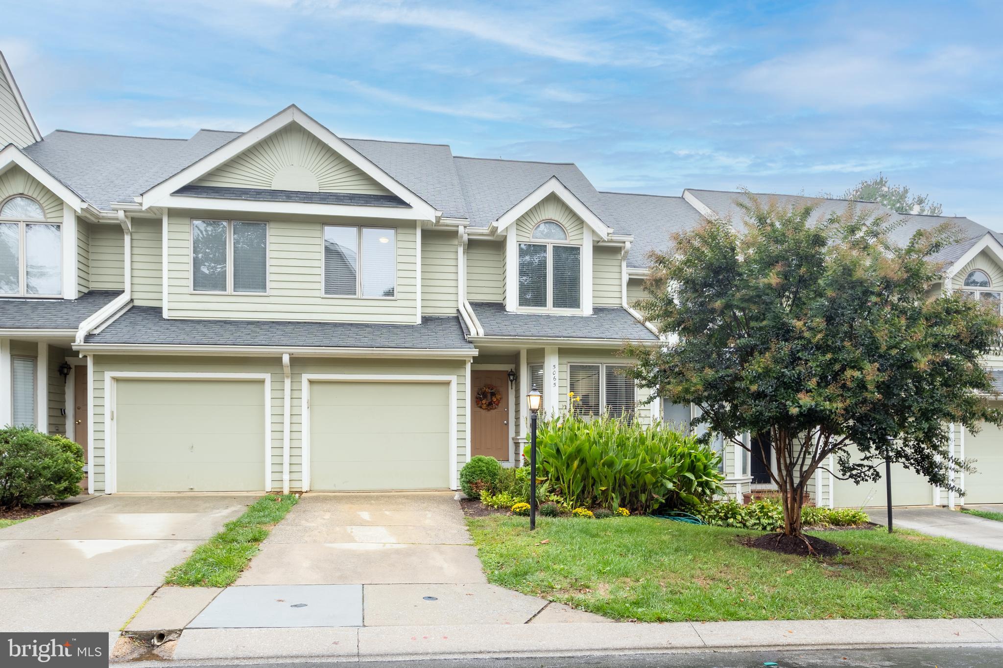 5065 Columbia Road, Unit 18 11 Columbia, MD 21044 - Photo 51 of 51 a front view of a house with a yard and garage