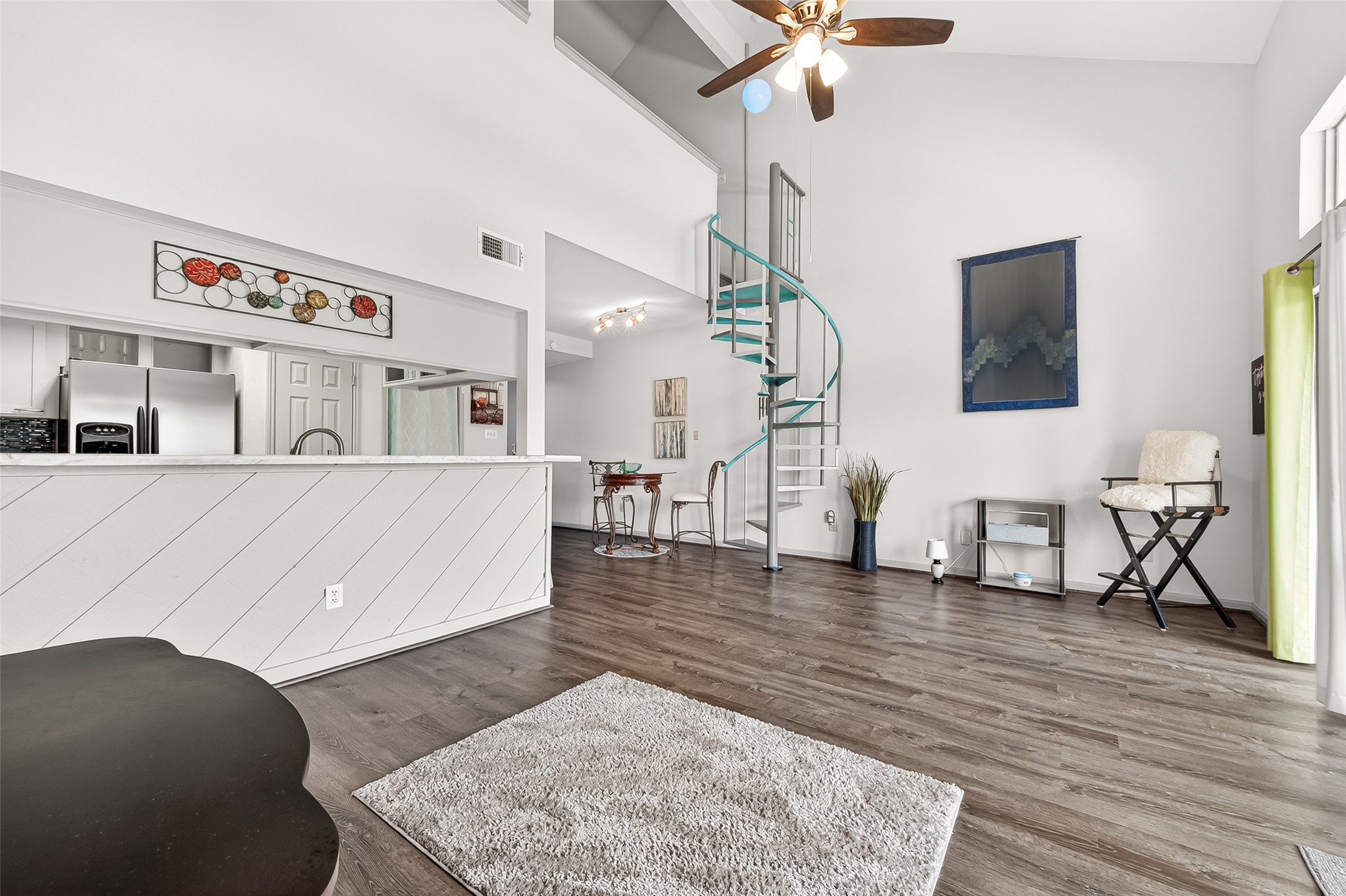 168 April Point Drive South, Unit 168 Conroe, TX 77356 - Photo 12 of 39 a living room with furniture and a wooden floor