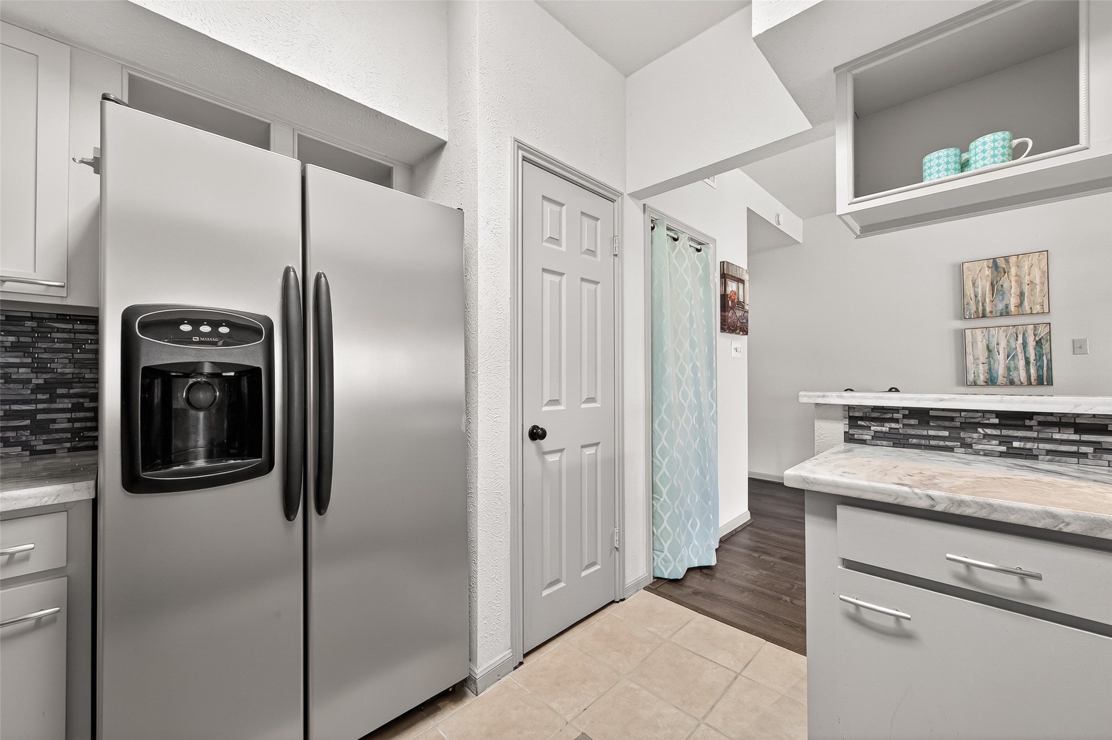 168 April Point Drive South, Unit 168 Conroe, TX 77356 - Photo 19 of 39 a kitchen with stainless steel appliances granite countertop a refrigerator and a stove