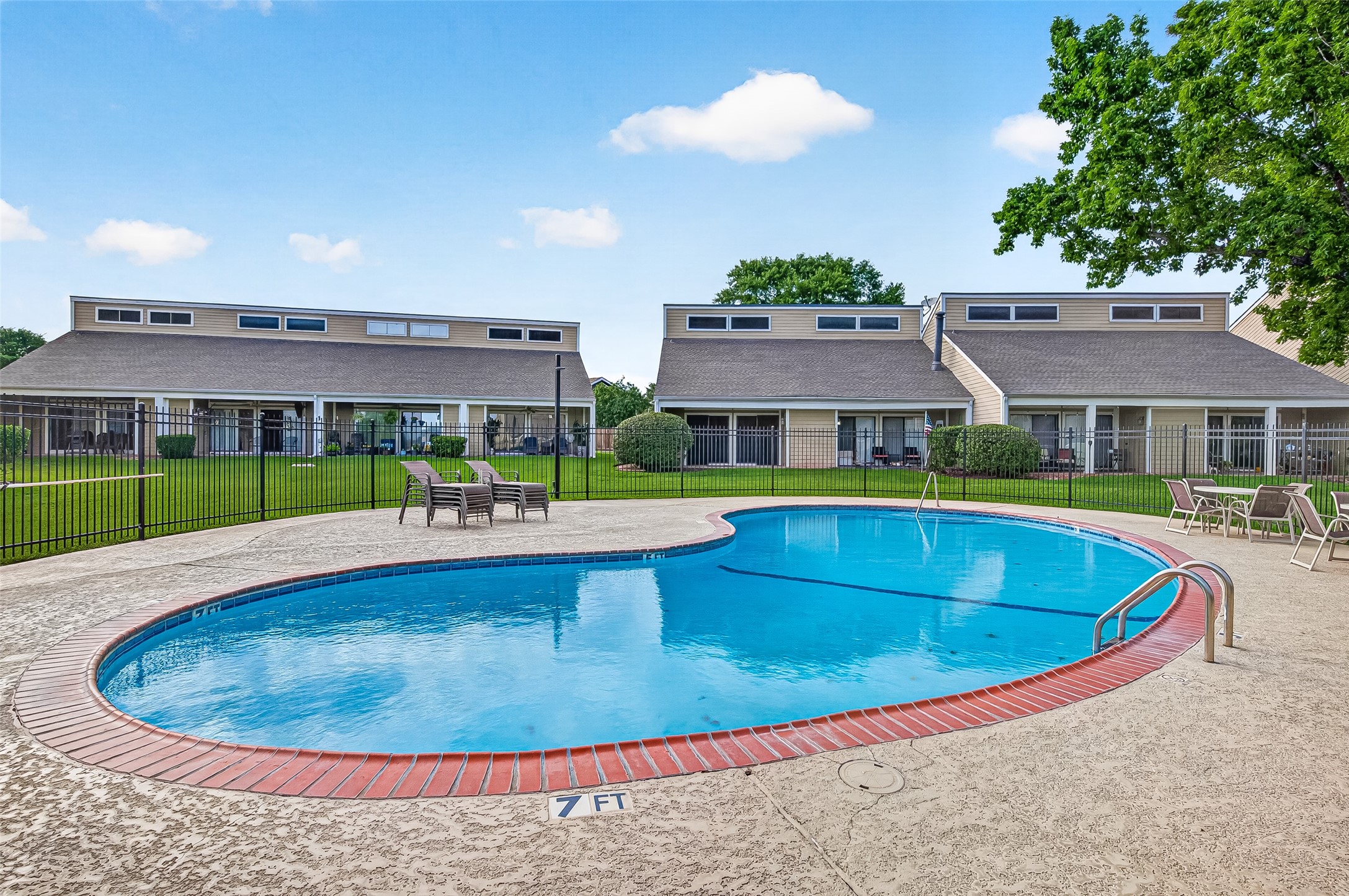 168 April Point Drive South, Unit 168 Conroe, TX 77356 - Photo 30 of 39 a view of a house with swimming pool and yard