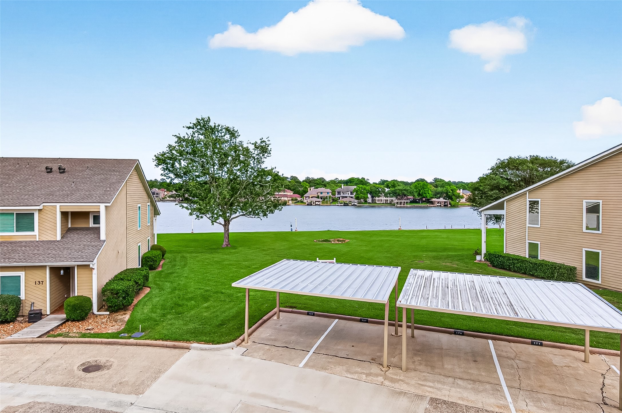 168 April Point Drive South, Unit 168 Conroe, TX 77356 - Photo 35 of 39 a view of a backyard with a garden and plants
