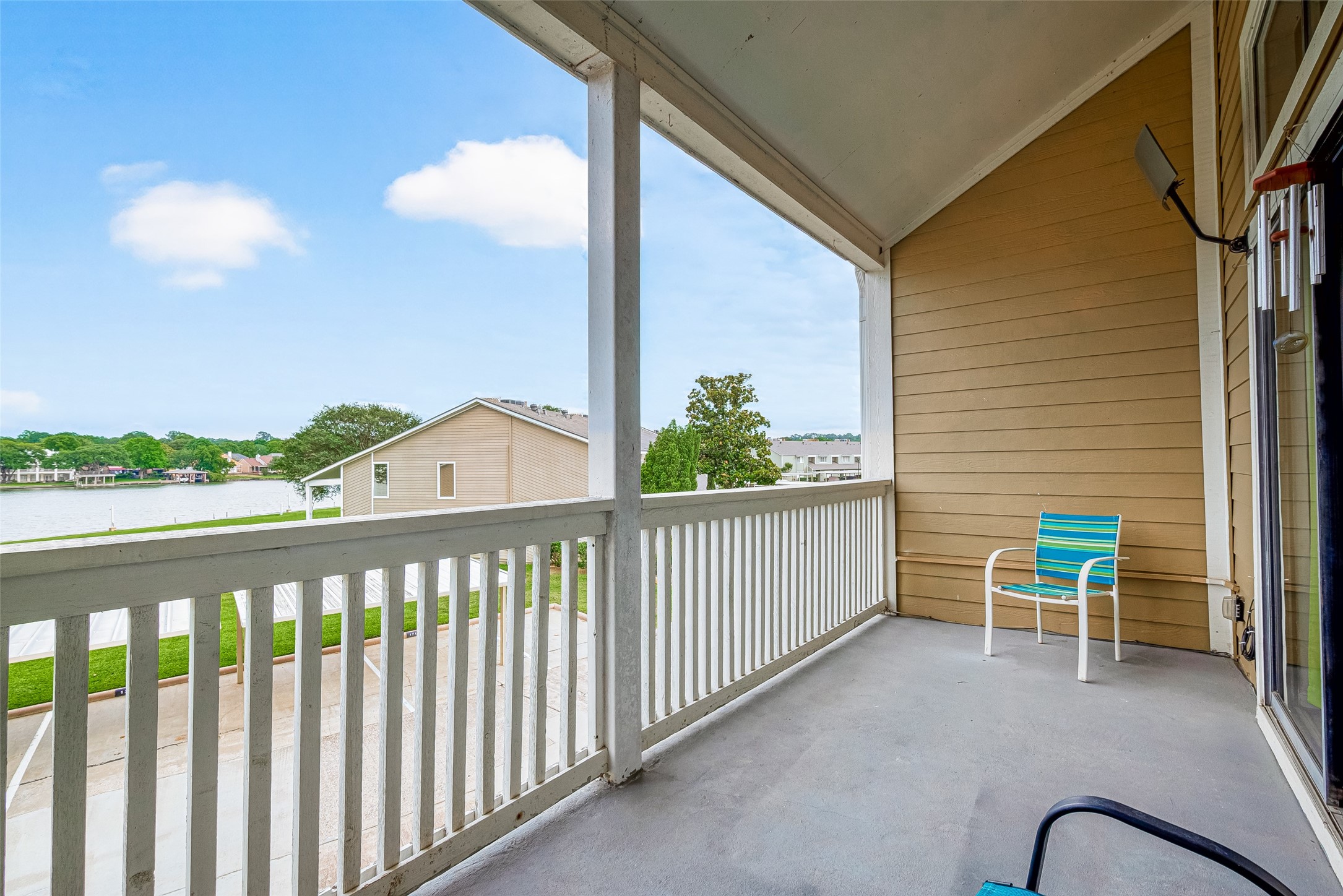 168 April Point Drive South, Unit 168 Conroe, TX 77356 - Photo 36 of 39 a view of a chair and table in the balcony